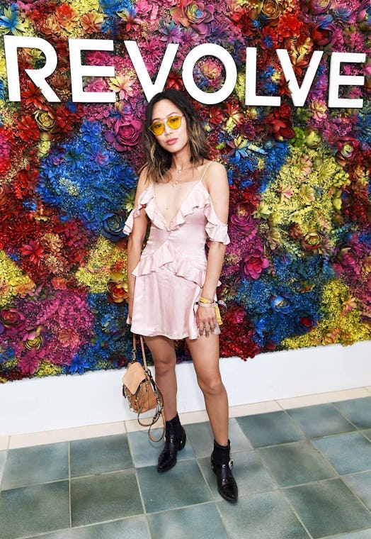 Aimee Song posing for a photo in a pink dress at the Coachella