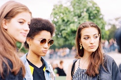 Three girls that hate sunscreen standing in a park