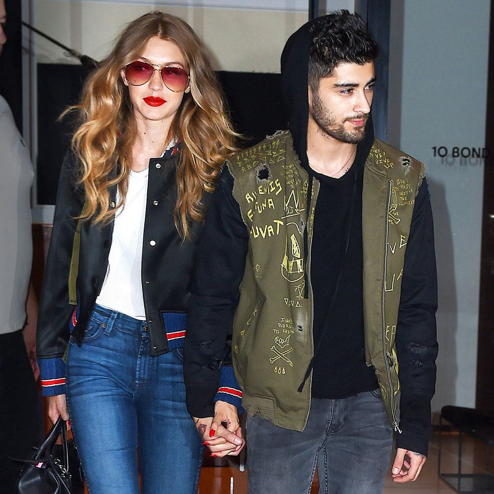 Zayn Malik And Gigi Hadid holding hands and walking