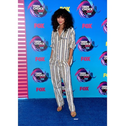 Zendaya posing in a striped ensemble at The 2017 Teen Choice Awards