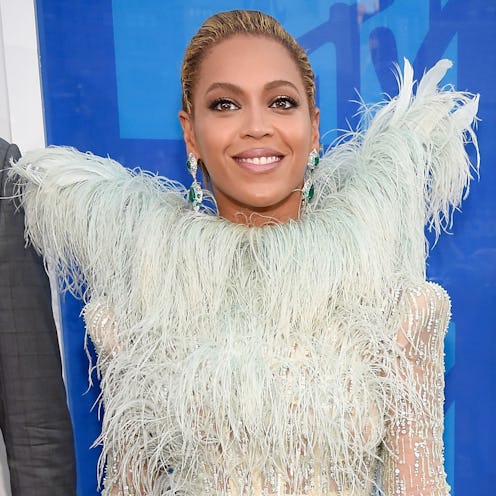 Beyonce at the VMAs wearing a white feather dress