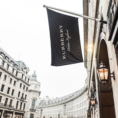 Black Burberry flag in front of a shop 