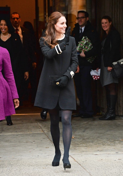 Kate Middleton wearing a black outfit while waving.