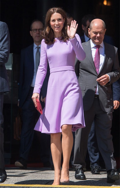 Kate Middleton wearing a lilac dress while waving