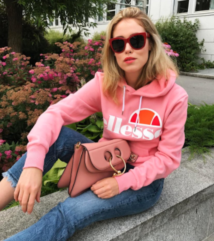 Annabel Rosendahl posing in a pink hoodie