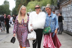 Three Scandinavian It girls walking the street in their fashion outfits