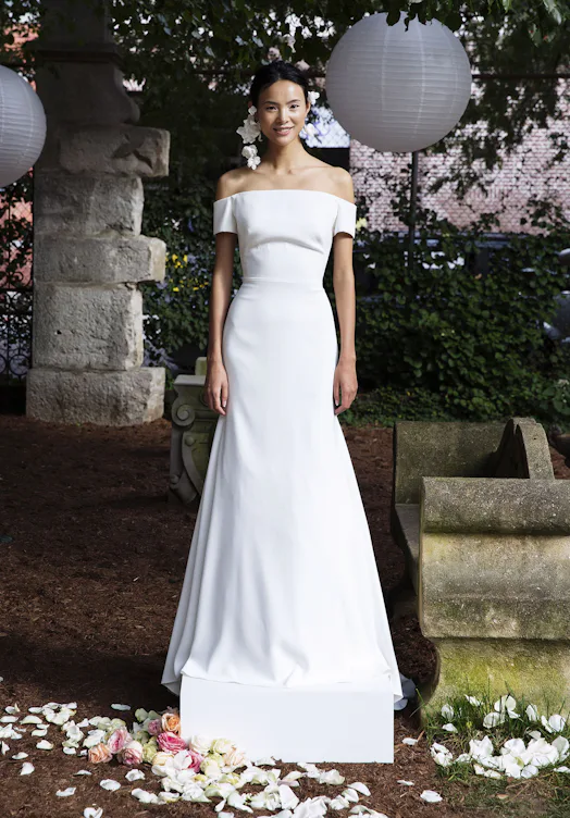 meghan markle white off the shoulder dress Meghan Markle Does Off-the-Shoulder Off-White