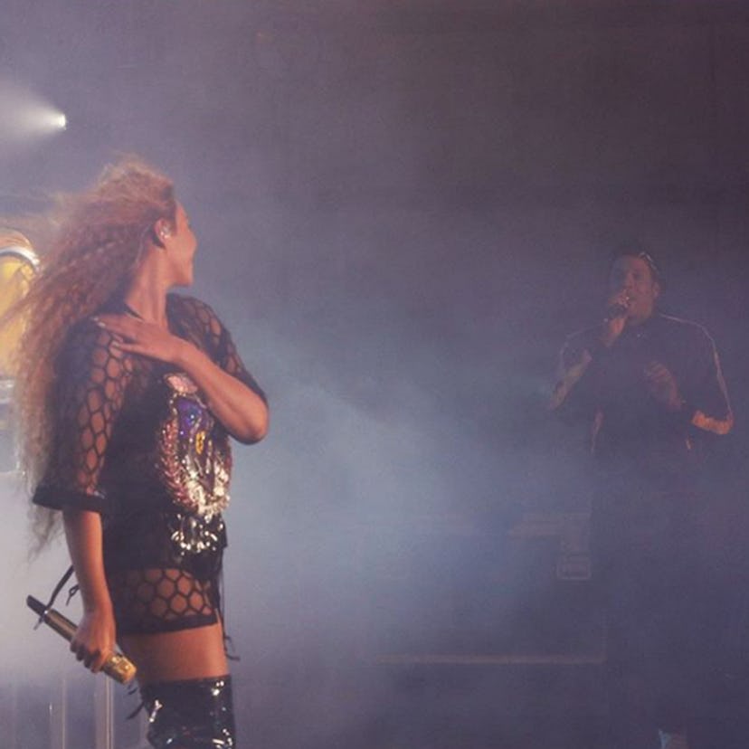 Beyoncé standing on a stage full of smoke