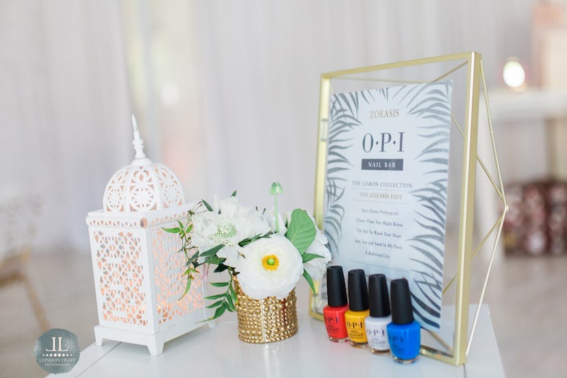 Blue, white, yellow, and red nail art bottles