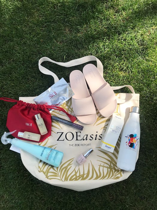 Sandals and creams on a bag placed on grass