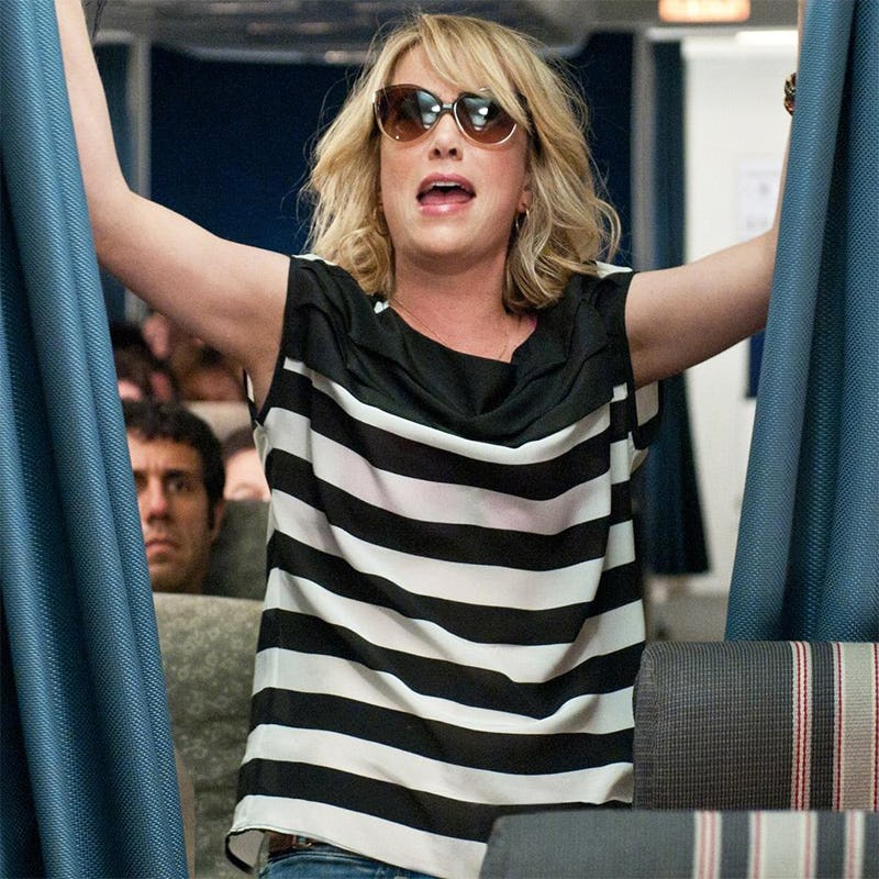 Kristen Wiig in a black-white striped top and sunglasses  after she overdid the booze