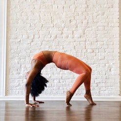 A woman in chic athletic wear doing a yoga pose