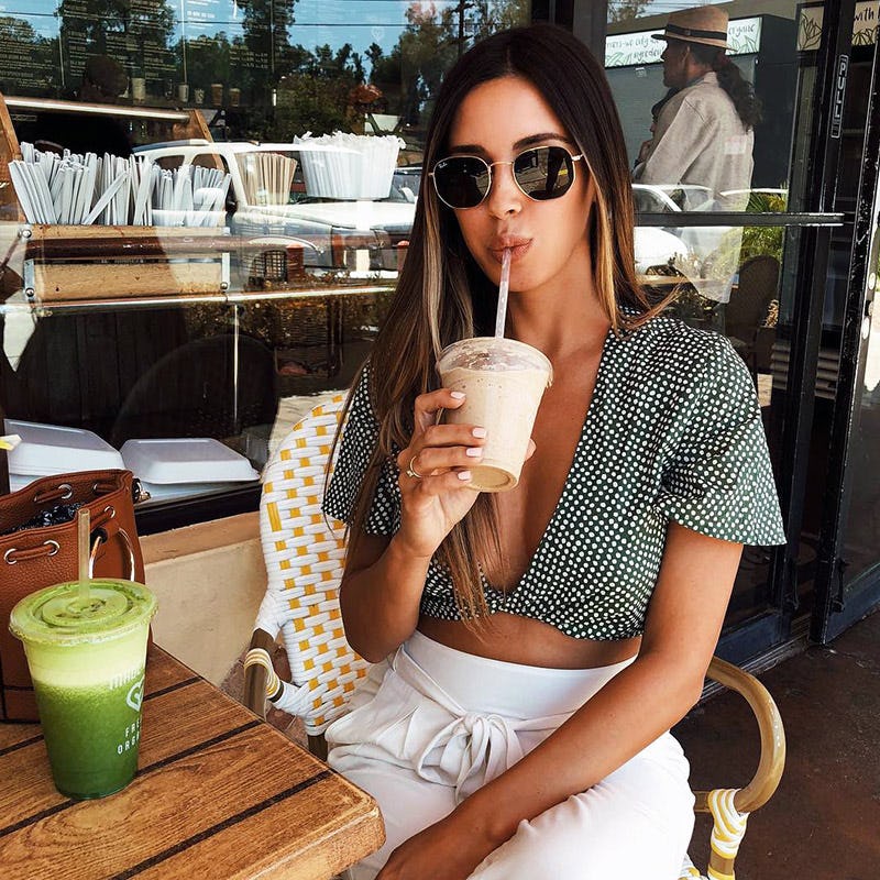 A girl drinking a next level supplement