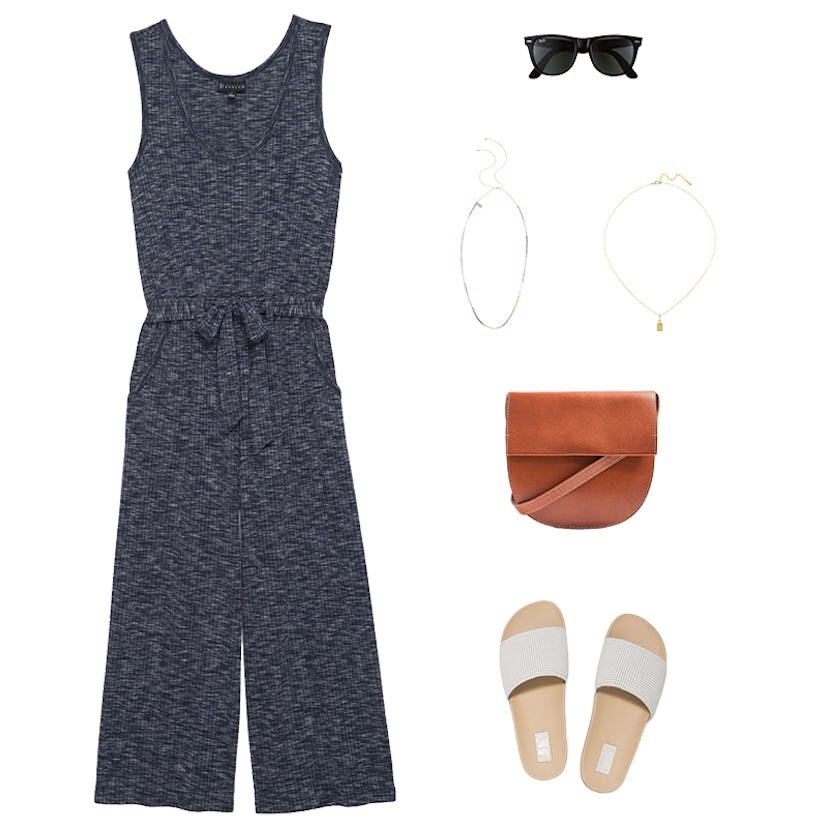A knit jumpsuit, a leather saddle bag, black sunglasses, two necklaces, and sandals 