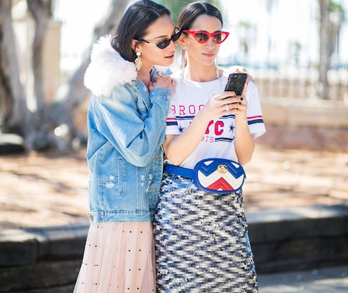 Two ladies using a shopping app on a phone