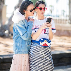 Two ladies using a shopping app on a phone