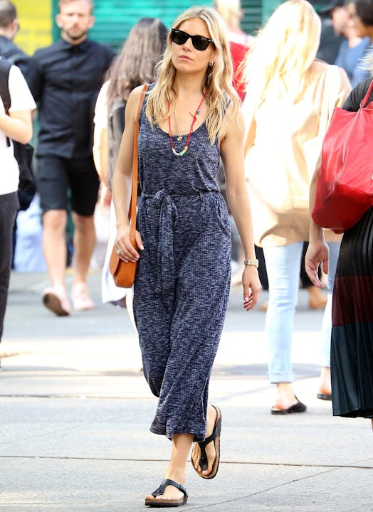 Sienna Miller walking while wearing an affordable cropped ribbed knit jumpsuit by Bobeau