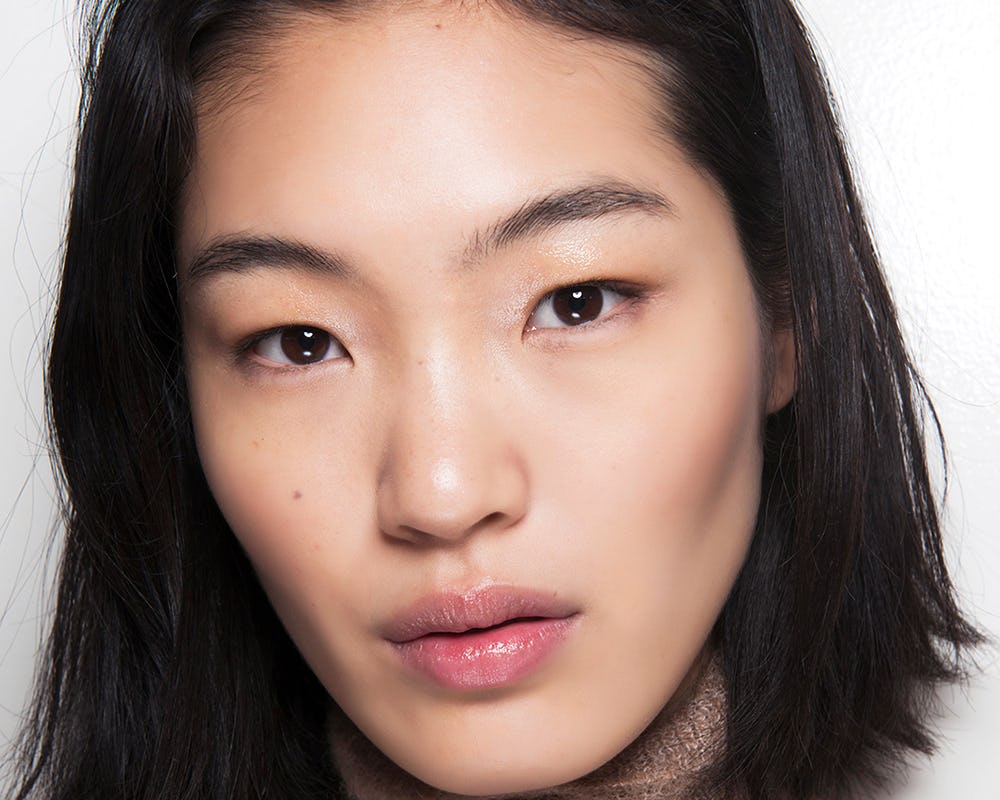Asian model promoting face cleansers perfect for every beauty routine.