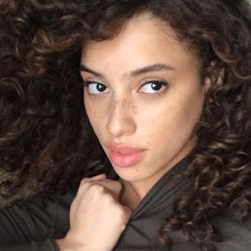 Khadijha posed selfie with curls and freckles