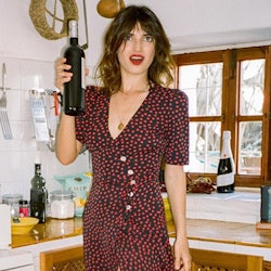 A woman wearing a black-red polka-dot dress as one of the outfit formulas French girls are obsessed ...