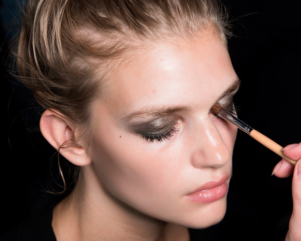 A model getting her make-up done with clean makeup tools