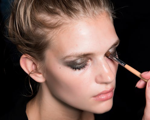 A model getting her make-up done with clean makeup tools
